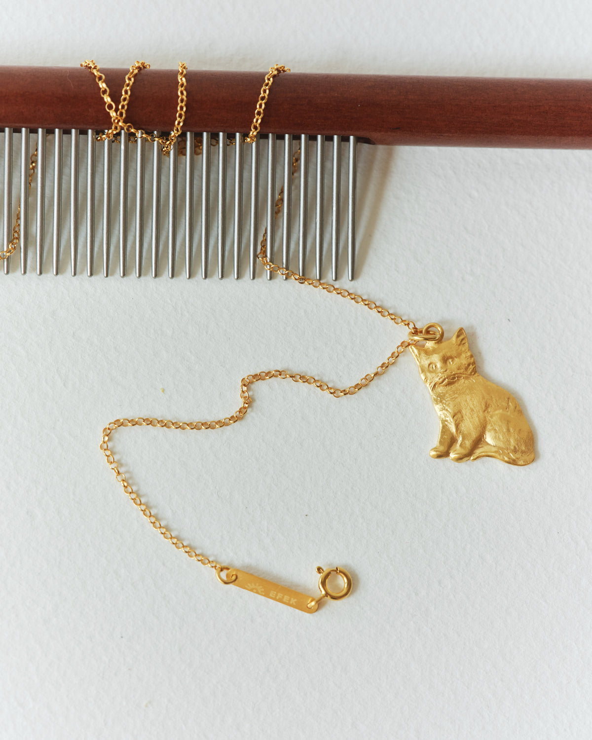 BONCUK cat pendant in a still life from EFEK’s Cats of Istanbul collection