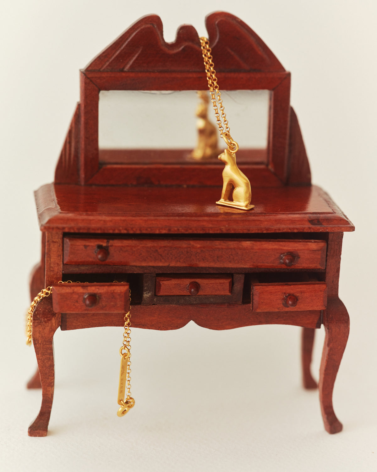 ZEYTİN cat pendant in a still life from EFEK’s Cats of Istanbul collection