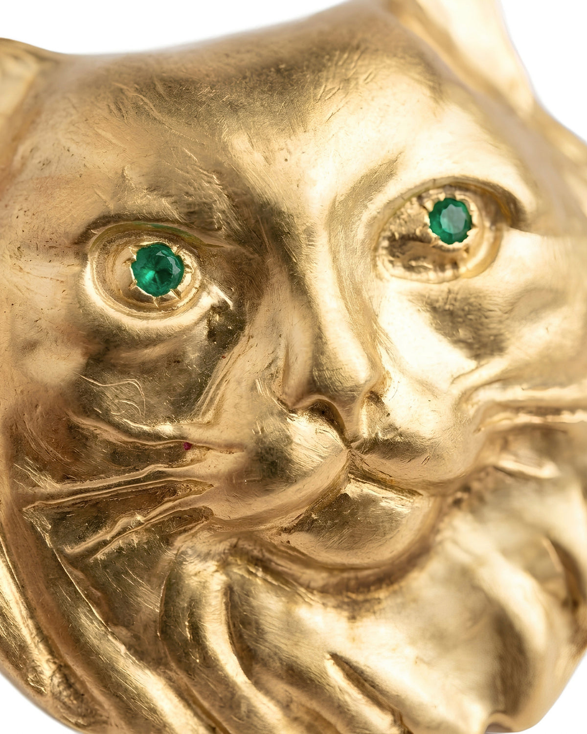 Detail of PAŞA 18K gold-plated cat brooch with natural emerald eyes by EFEK