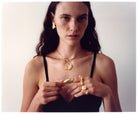 A model wearing various jewelry from EFEK Cats of Istanbul collection, photographed by Alessandro Oliva.
