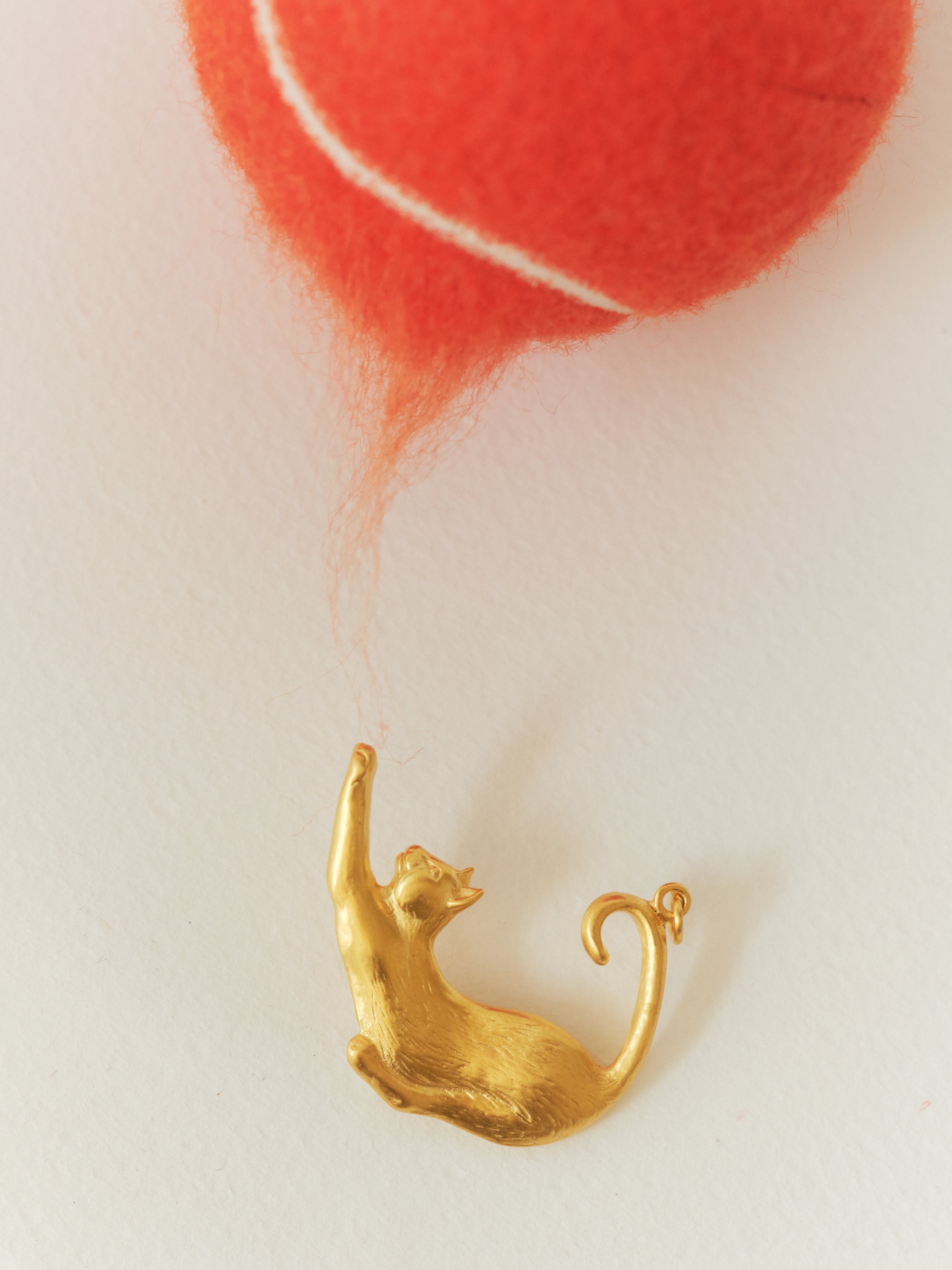 BİBER cat pendant in a still life from EFEK’s Cats of Istanbul collection