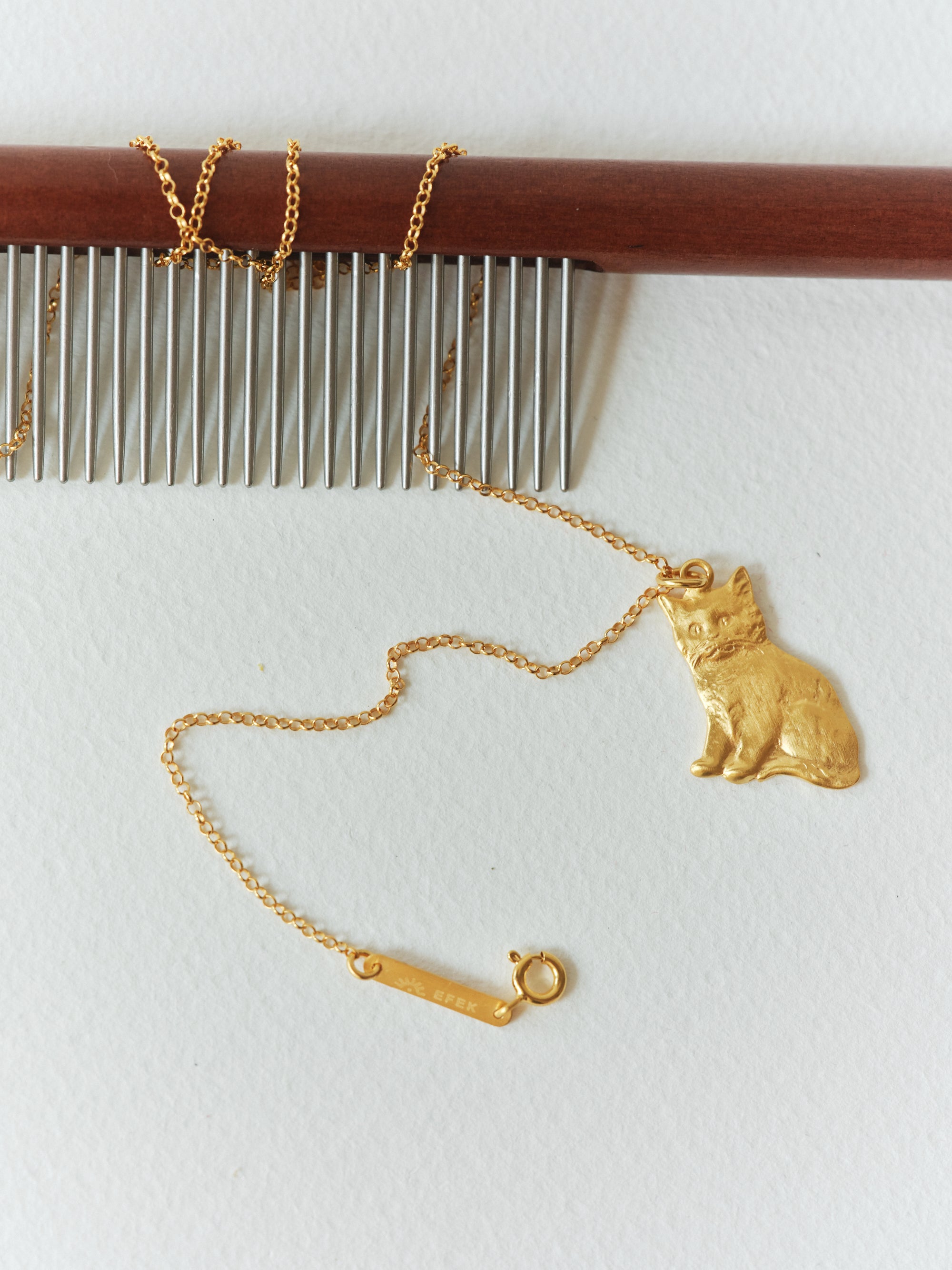 BONCUK cat pendant in a still life from EFEK’s Cats of Istanbul collection