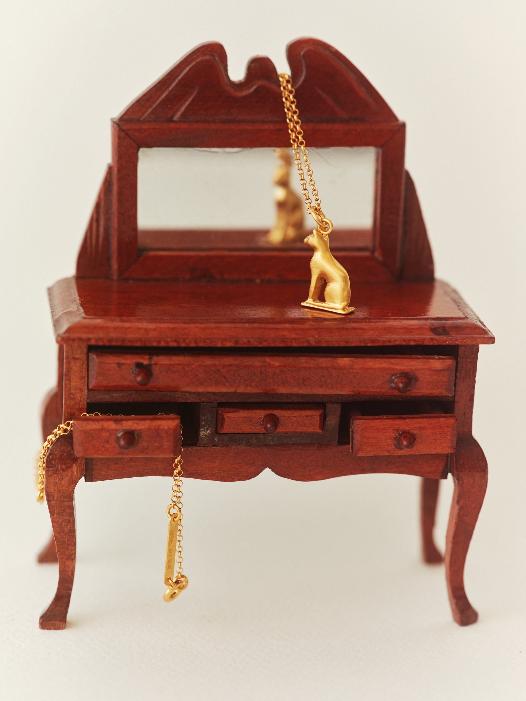 ZEYTİN cat pendant in a still life from EFEK’s Cats of Istanbul collection